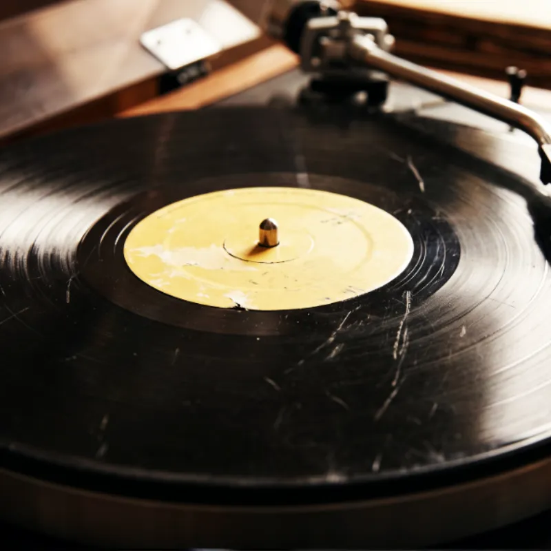 Deep surface scratch on vinyl record groove causing playback pop