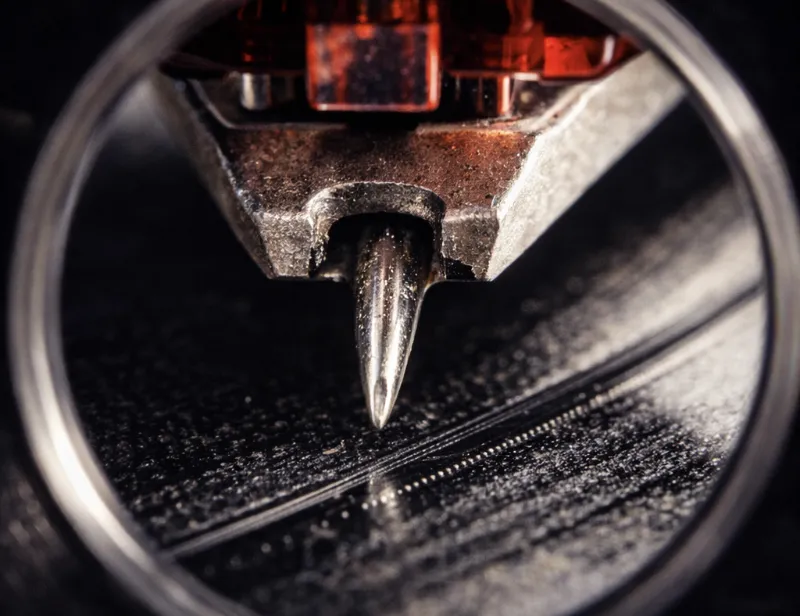 Stereo microscope bench evaluating diamond contact patches and cantilever alignment