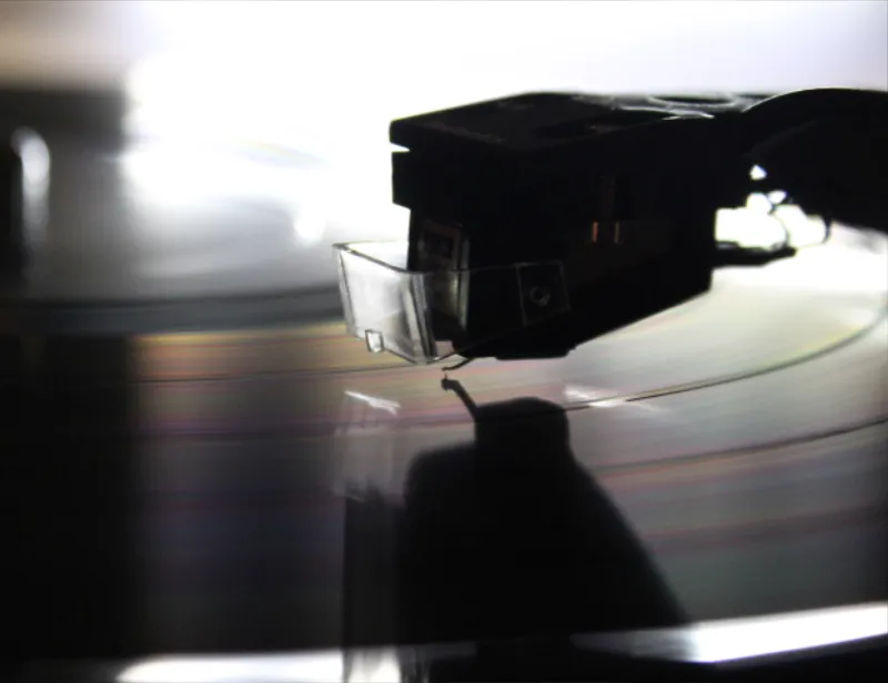Vinyl microgroove wall damage caused by listening through a worn out diamond needle